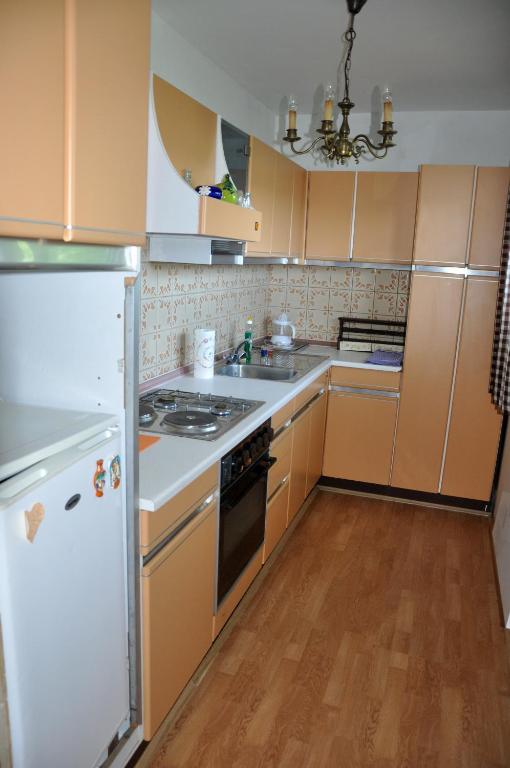Kuchyň nebo kuchyňský kout v ubytování Apartments MM