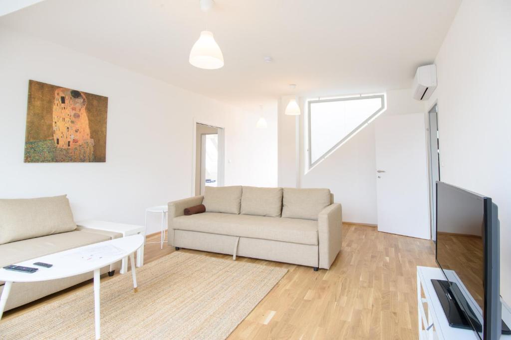 Televízia a/alebo spoločenská miestnosť v ubytovaní Vienna City Apartments 1100 Vienna