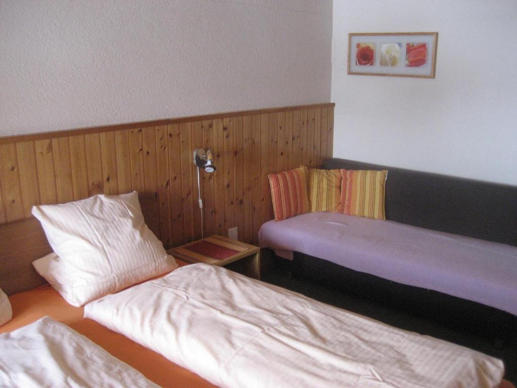 Postel nebo postele na pokoji v ubytování B&B Pension Lärch