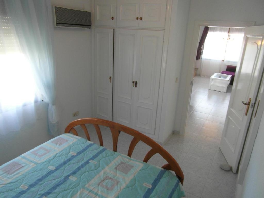 Postel nebo postele na pokoji v ubytování Apartamento con jardin