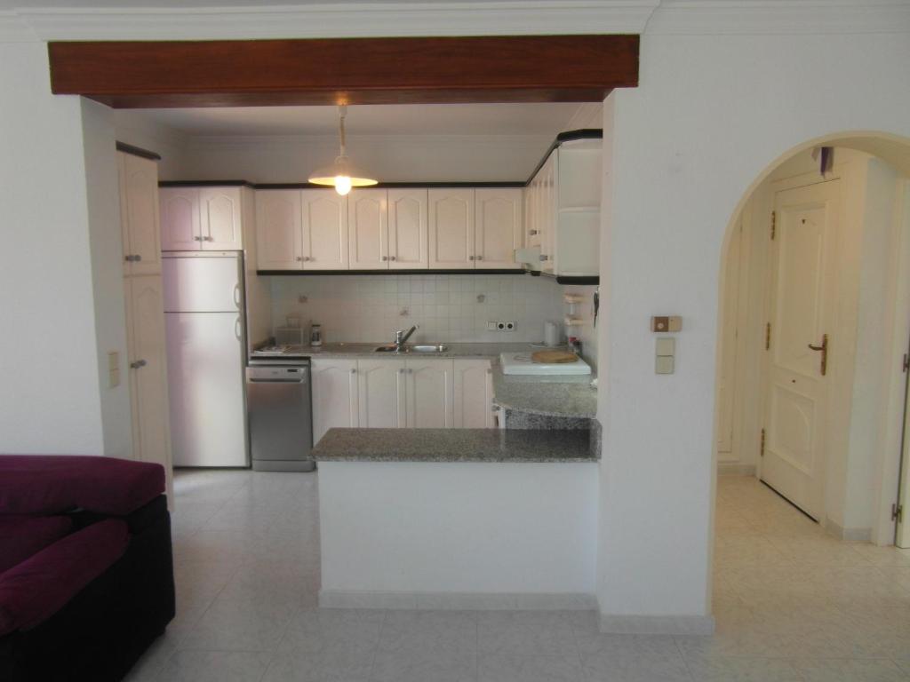 Kuchyň nebo kuchyňský kout v ubytování Apartamento con jardin