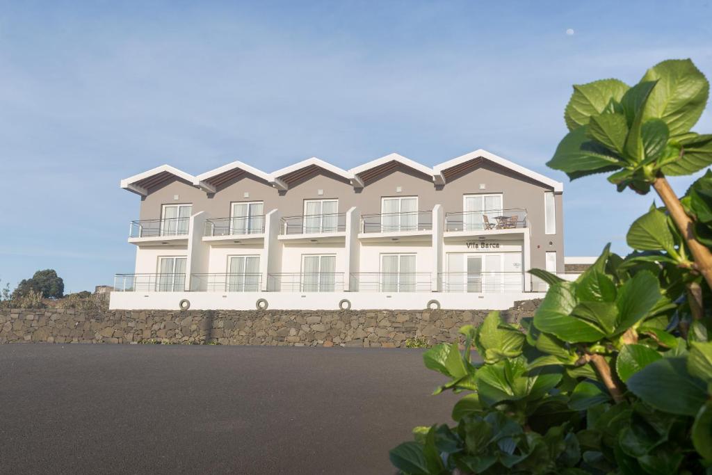 an architectural rendering of a building on a stone wall at Vila Barca in Madalena