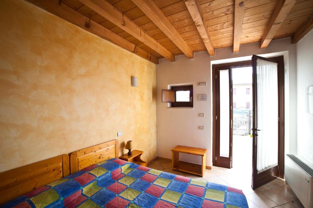 Postel nebo postele na pokoji v ubytování Agriturismo Le Sigalette