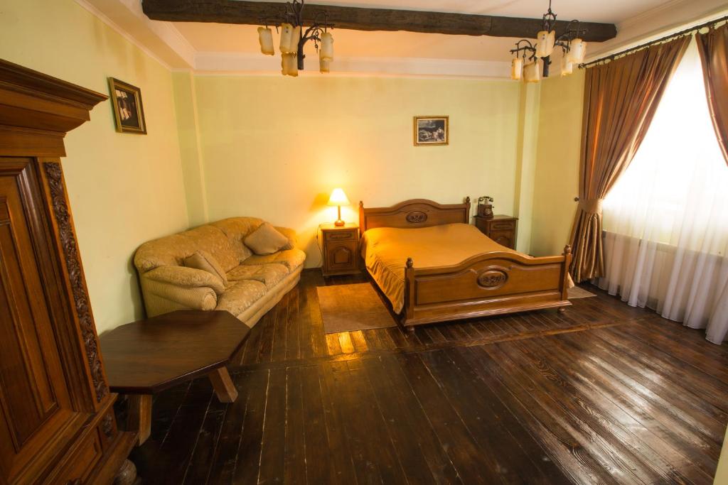 Postel nebo postele na pokoji v ubytování Magnat Lux Hotel