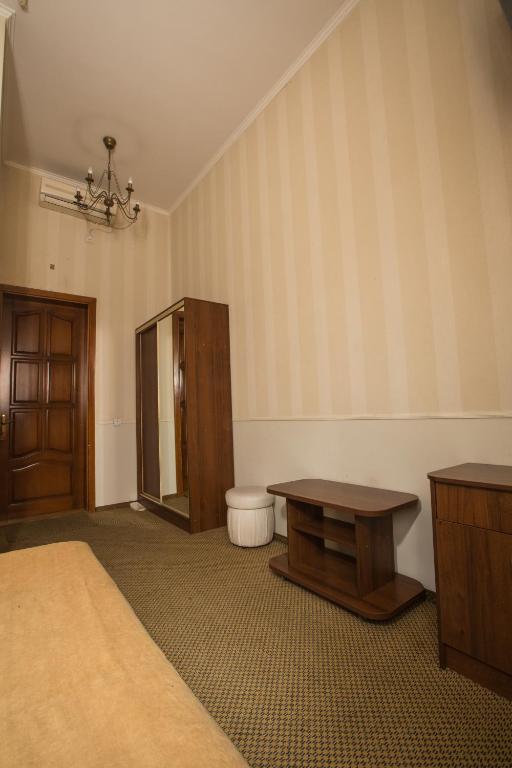 Postel nebo postele na pokoji v ubytování Magnat Lux Hotel