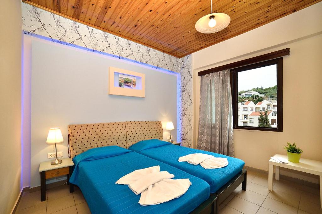 Postel nebo postele na pokoji v ubytování Mythos- Platanias- Hotel -Apts
