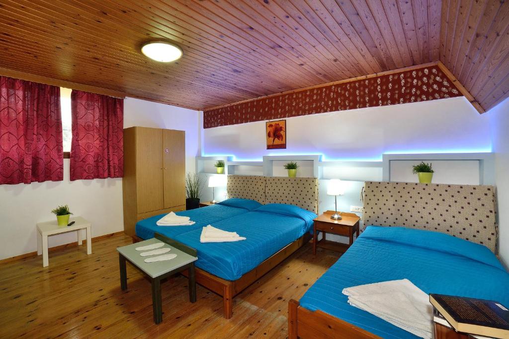 Postel nebo postele na pokoji v ubytování Mythos- Platanias- Hotel -Apts