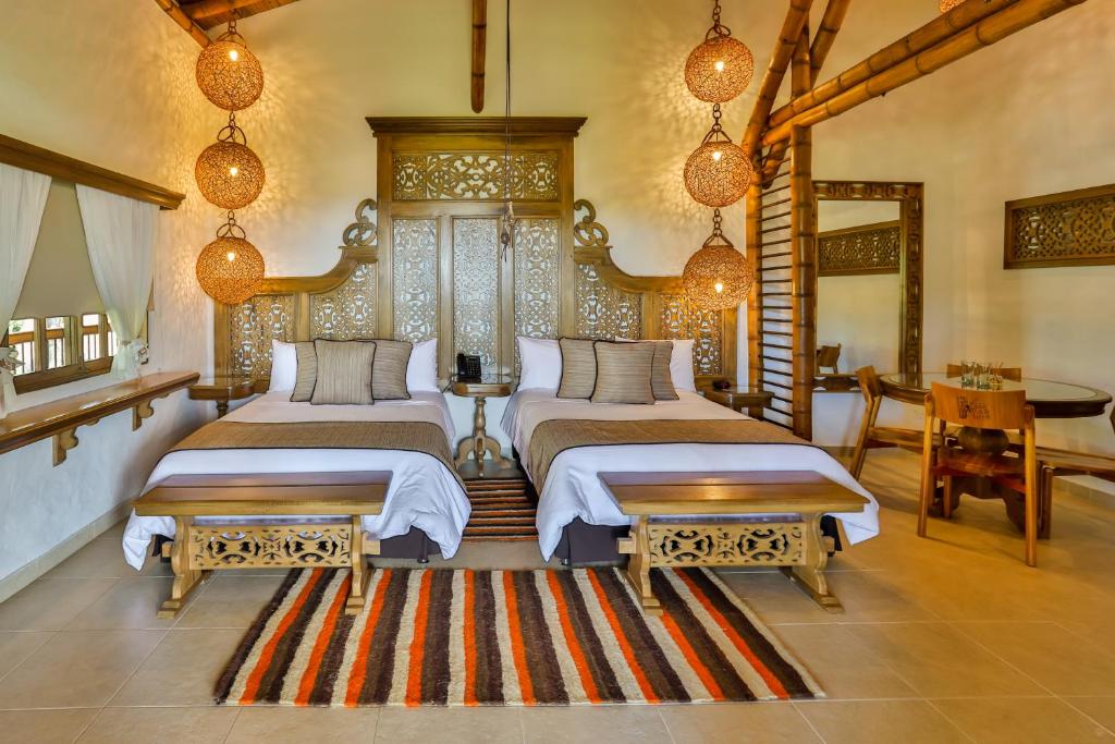Postel nebo postele na pokoji v ubytování Hotel Casa San Carlos Lodge Pereira