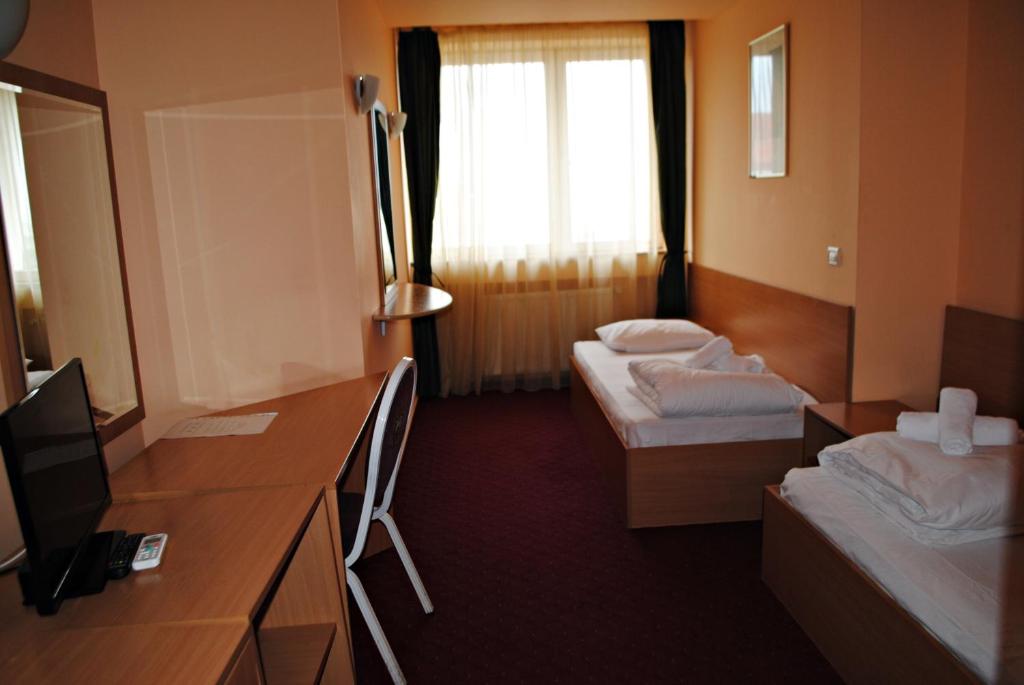 Postel nebo postele na pokoji v ubytování CT Tm