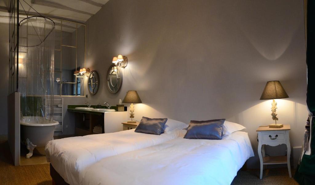 Postel nebo postele na pokoji v ubytování L'Arcane Du Bellay