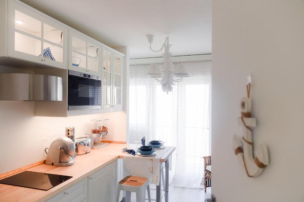 Kuchyň nebo kuchyňský kout v ubytování Ül Laghèe Blevio Apartments