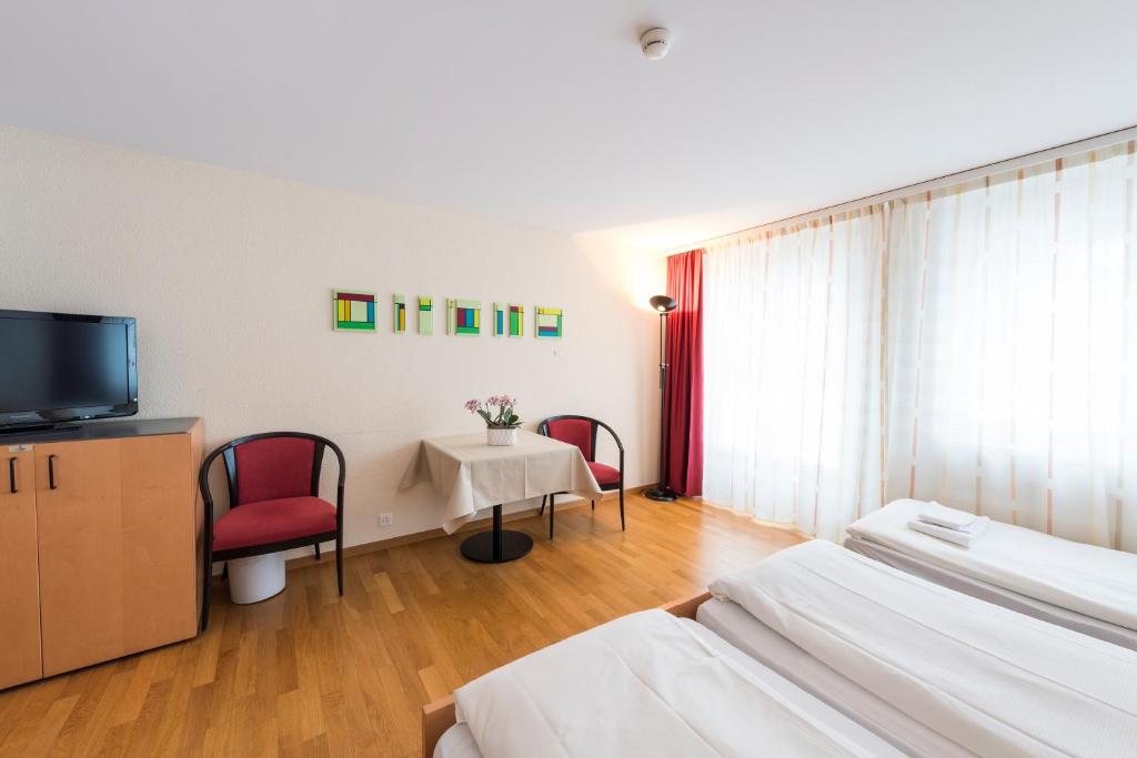 TV a/nebo společenská místnost v ubytování Hotel Krone