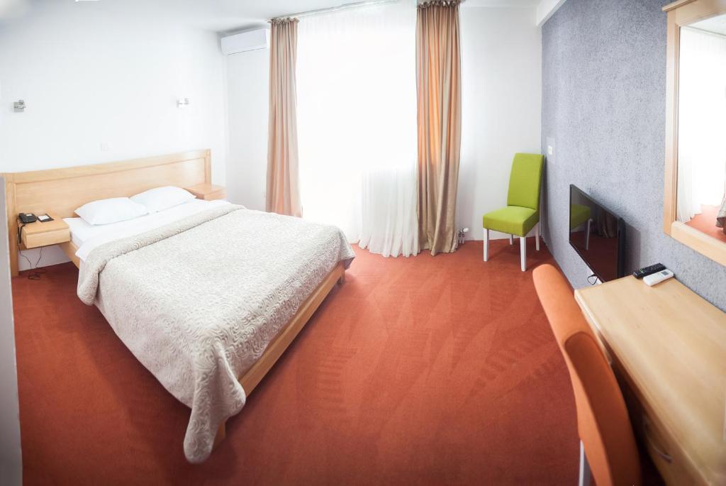 Postel nebo postele na pokoji v ubytování Hotel Serdar