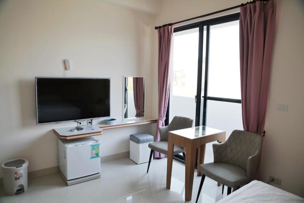 TV a/nebo společenská místnost v ubytování Caibei Homestay