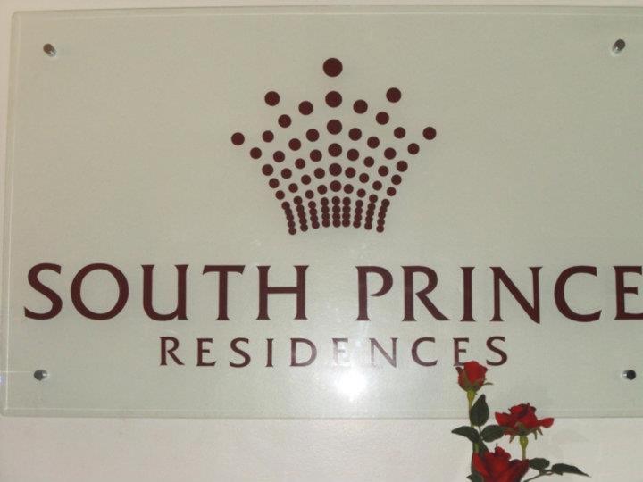 a sign for south princeresence on a wall at South Prince Residences and Inn in Davao City