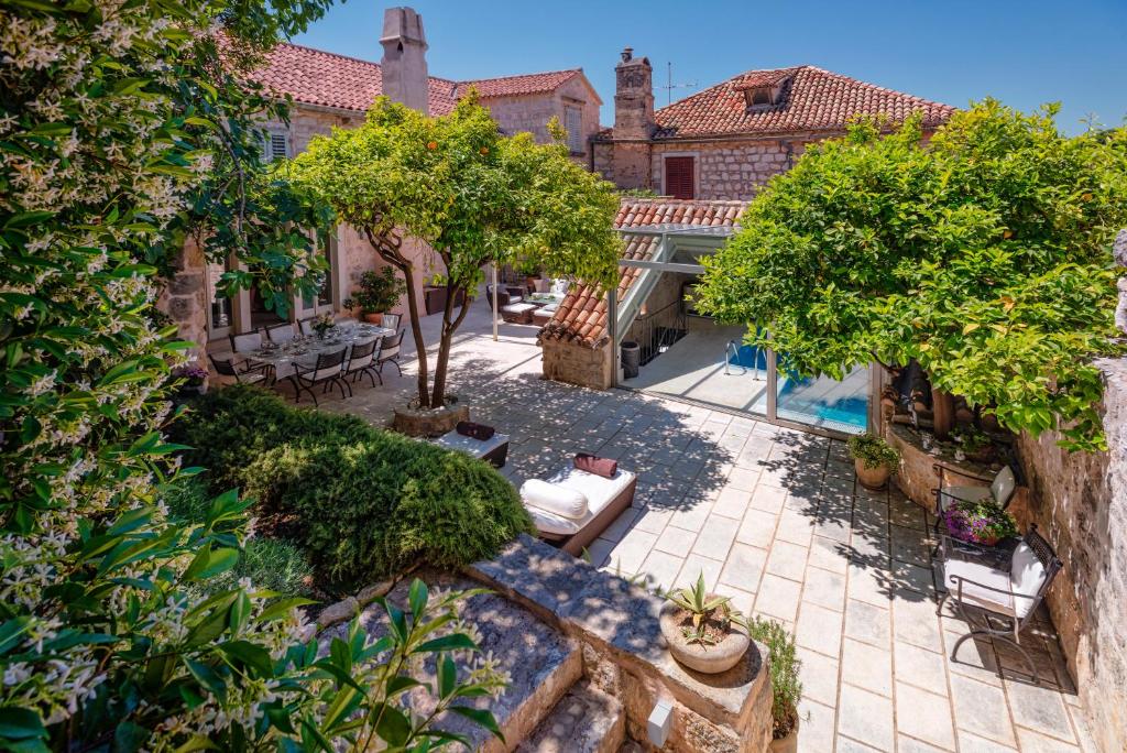 an aerial view of a courtyard with a house at Heraclea House in Hvar