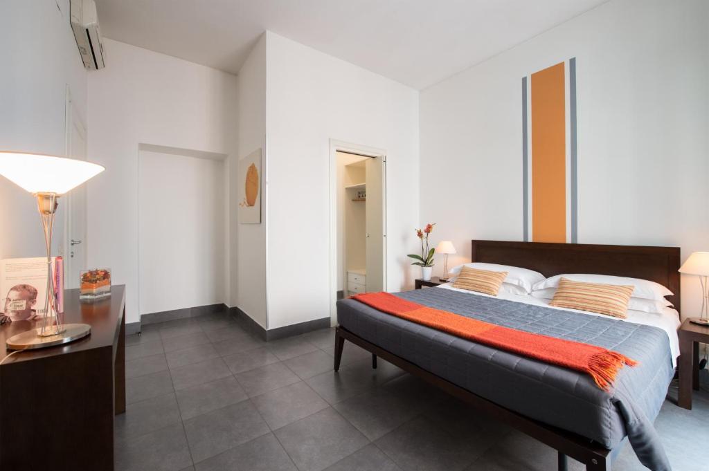 Postel nebo postele na pokoji v ubytování Residenza Termini