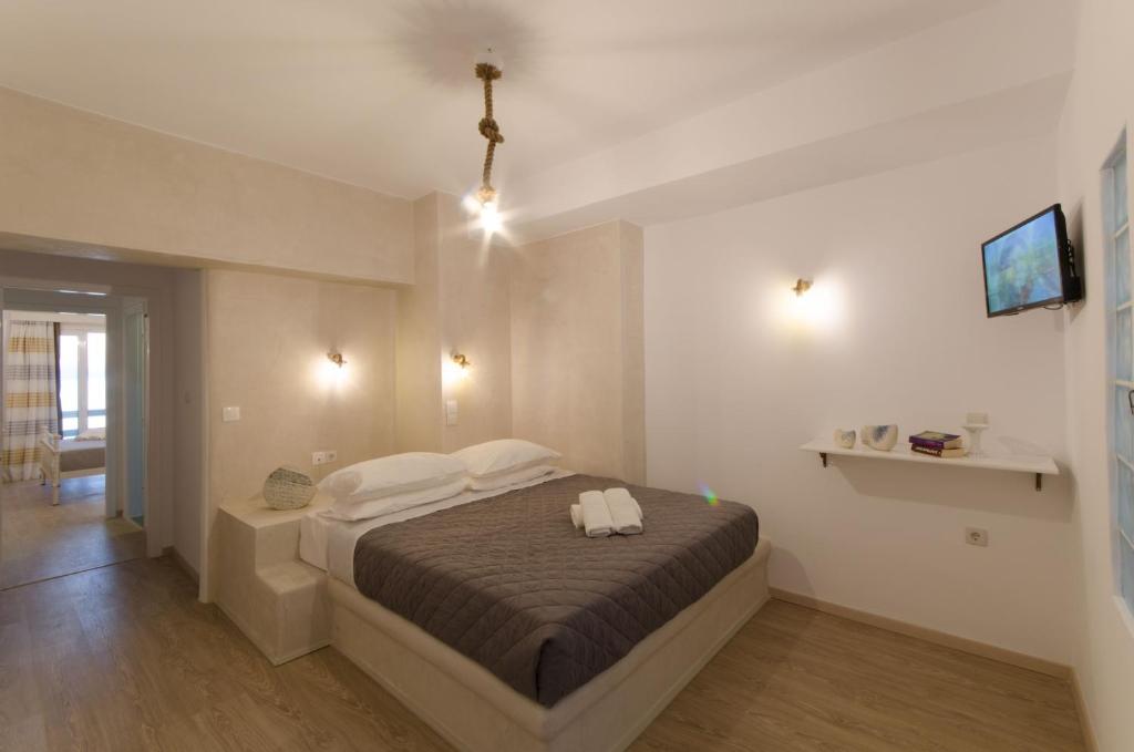 Postel nebo postele na pokoji v ubytování Nikolas Hotel