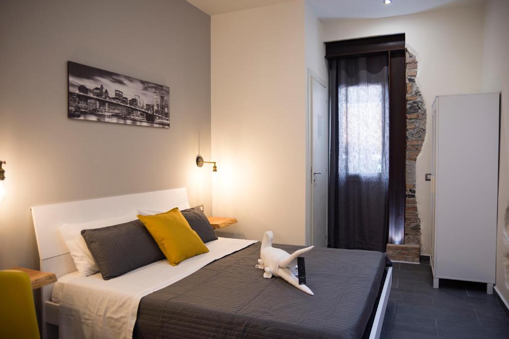 Ένα ή περισσότερα κρεβάτια σε δωμάτιο στο Passi di Mare Rooms