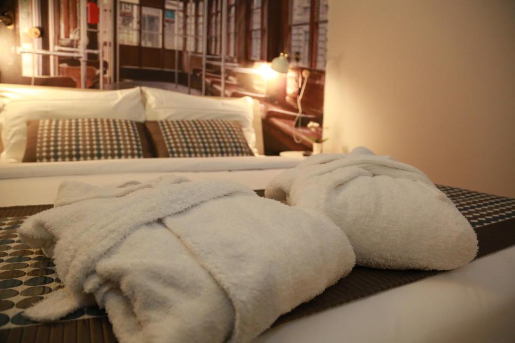 Postel nebo postele na pokoji v ubytování Aparthotel Meneghino