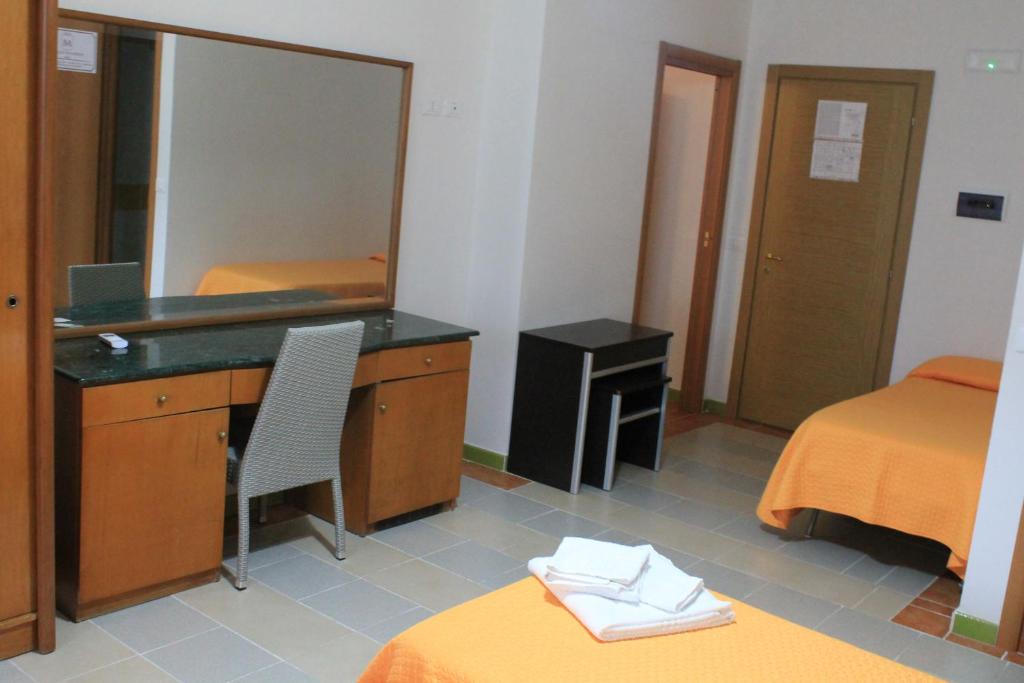 Postel nebo postele na pokoji v ubytování B&B Palazzo Manfredi Vieste, Fronte mare con Parcheggio