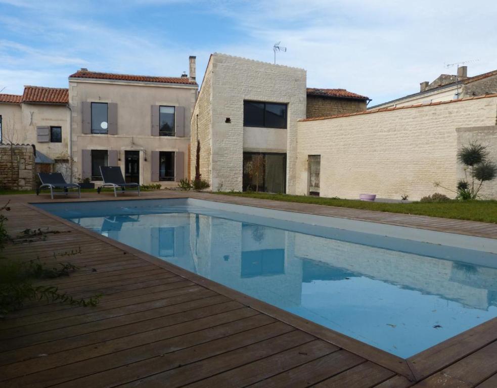 a swimming pool in the backyard of a house at Maison En Ville in Niort