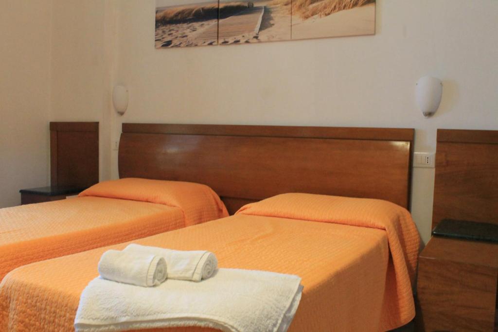 Postel nebo postele na pokoji v ubytování B&B Palazzo Manfredi Vieste, Fronte mare con Parcheggio