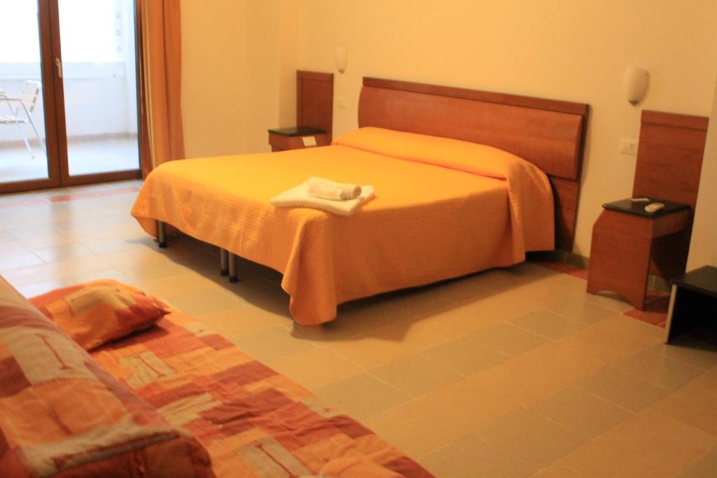 Postel nebo postele na pokoji v ubytování B&B Palazzo Manfredi Vieste, Fronte mare con Parcheggio