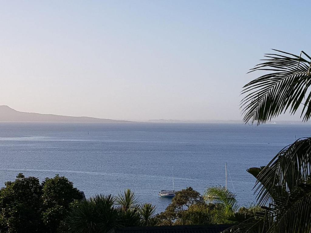 a boat in a large body of water at Close to beach in Auckland
