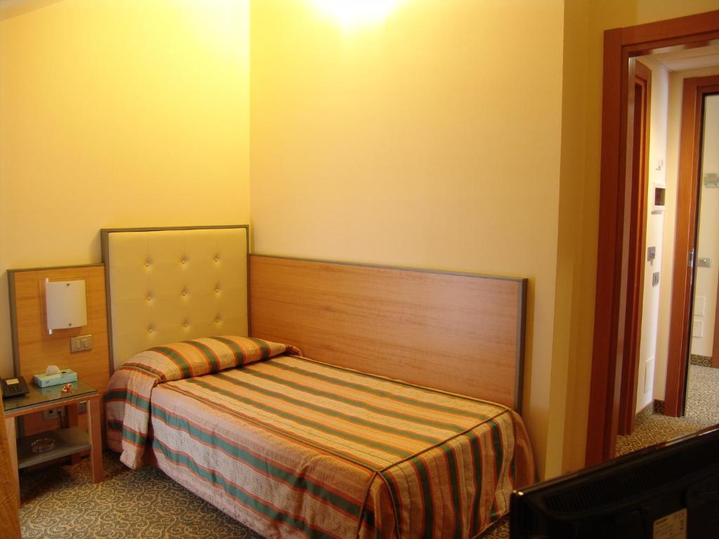 Postel nebo postele na pokoji v ubytování Hotel Kristall