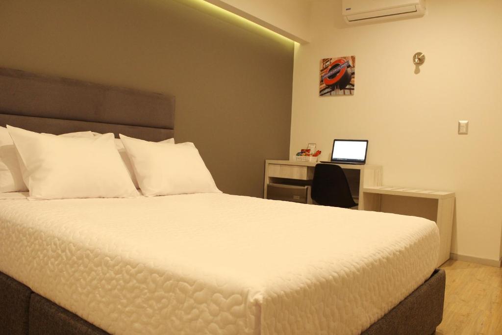 Postel nebo postele na pokoji v ubytování Awqa Hoteles - Sede Natasha