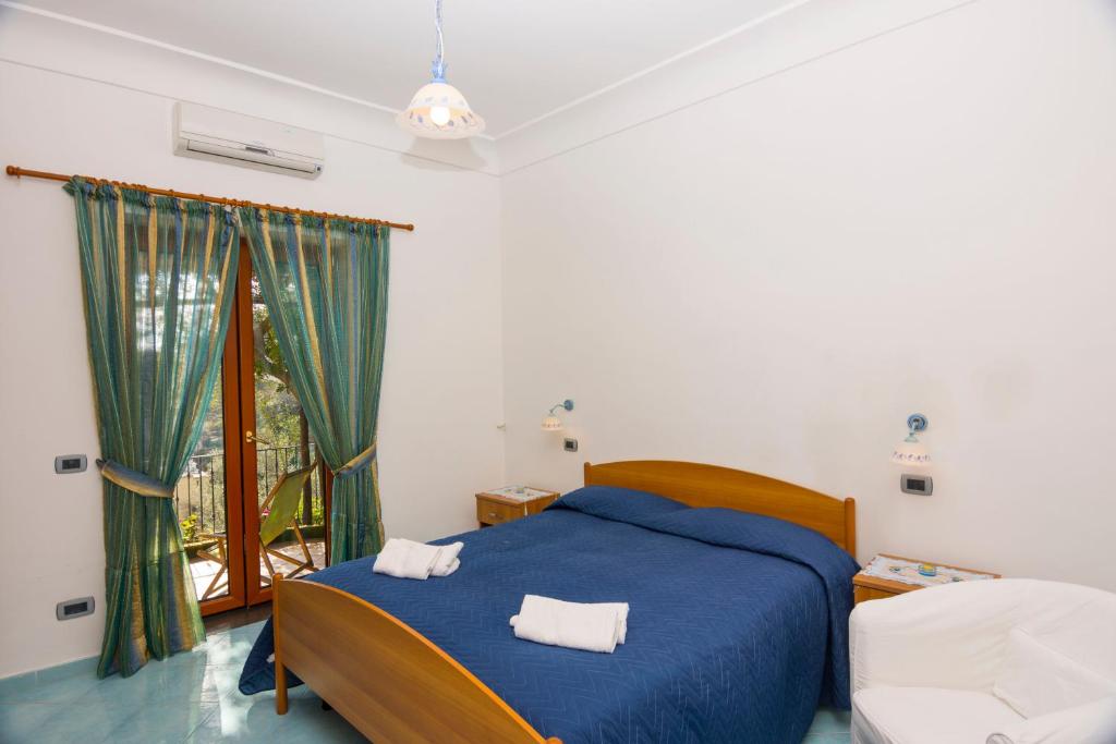 Postel nebo postele na pokoji v ubytování Le Nereidi B&B