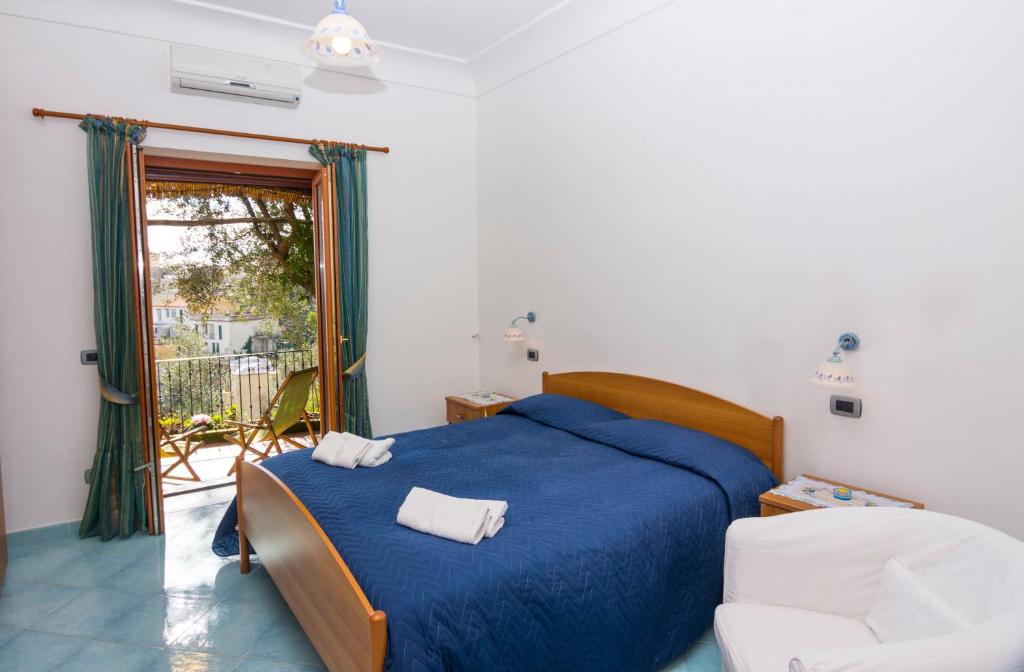 Postel nebo postele na pokoji v ubytování Le Nereidi B&B