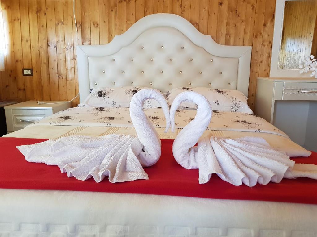 Postel nebo postele na pokoji v ubytování Hotel Vataksi