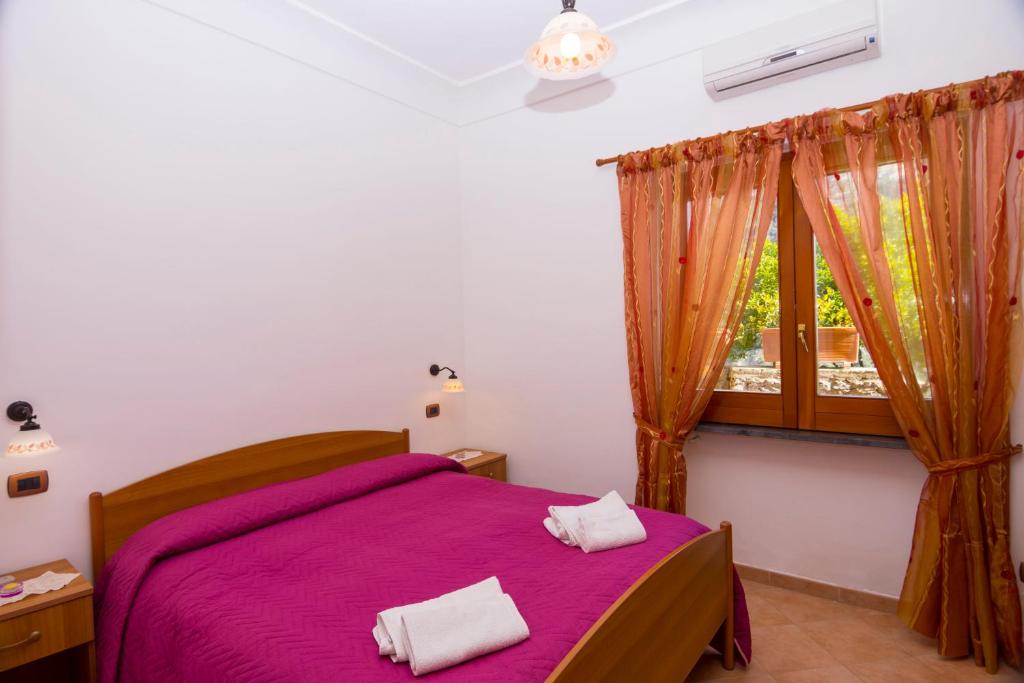 Postel nebo postele na pokoji v ubytování Le Nereidi B&B