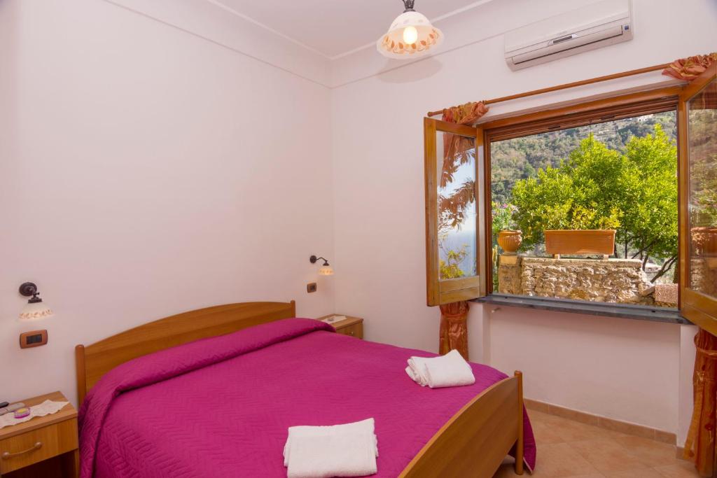 Postel nebo postele na pokoji v ubytování Le Nereidi B&B