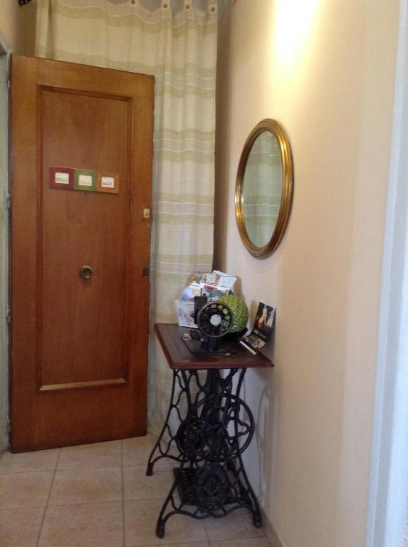 a room with a table with a mirror and a door at Apartamento Rural situado en tercera planta sin ascensor in Navás