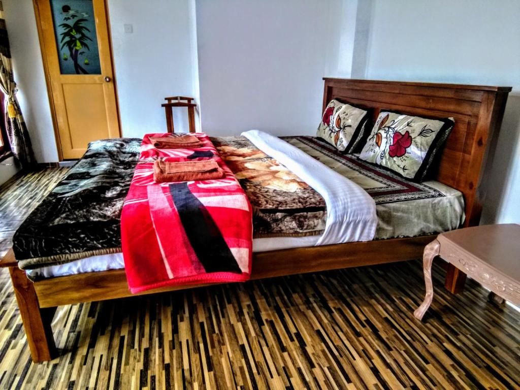 Postel nebo postele na pokoji v ubytování travellers nest inn
