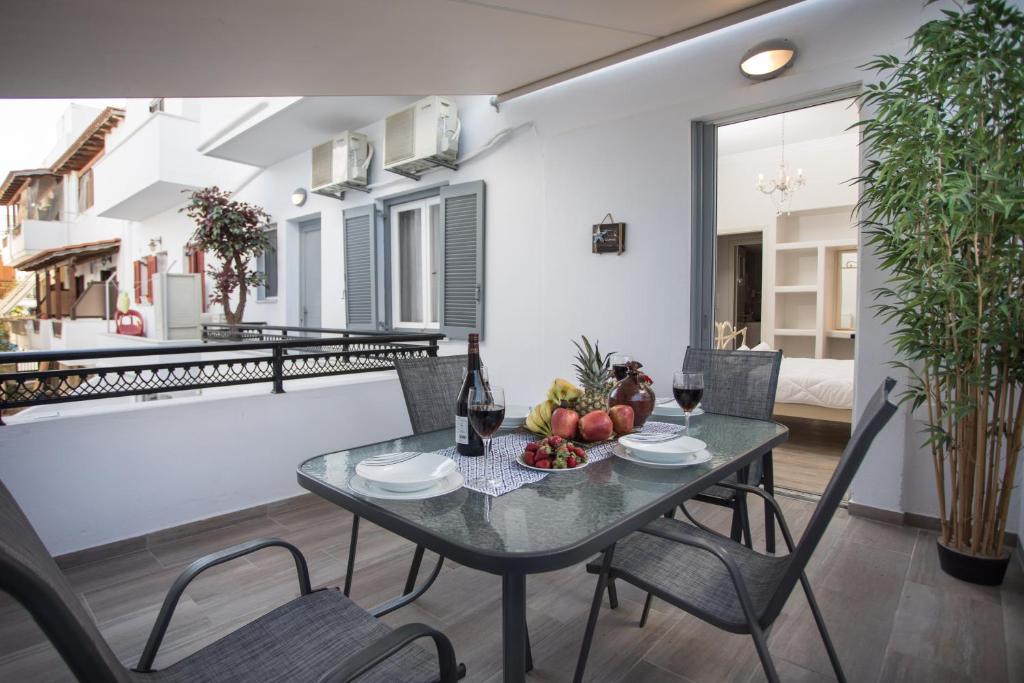 a dining room with a table and chairs at Relax Studios in Naxos Chora