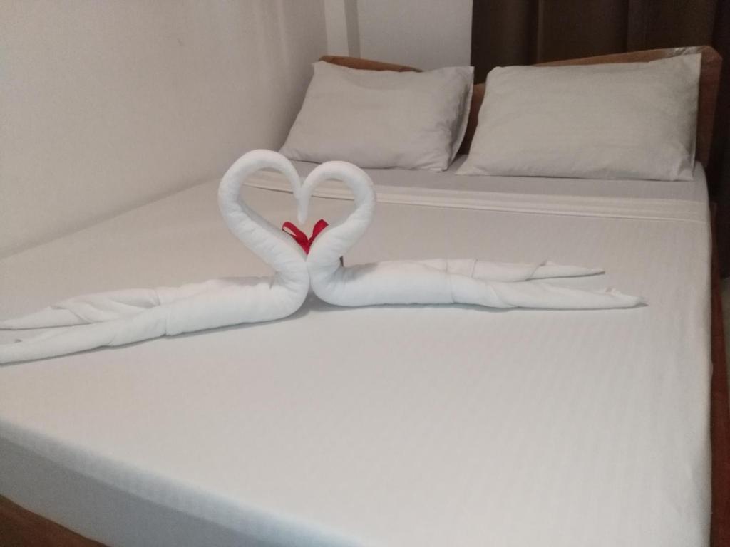 Postel nebo postele na pokoji v ubytování Zenith Inn & Resto Bar