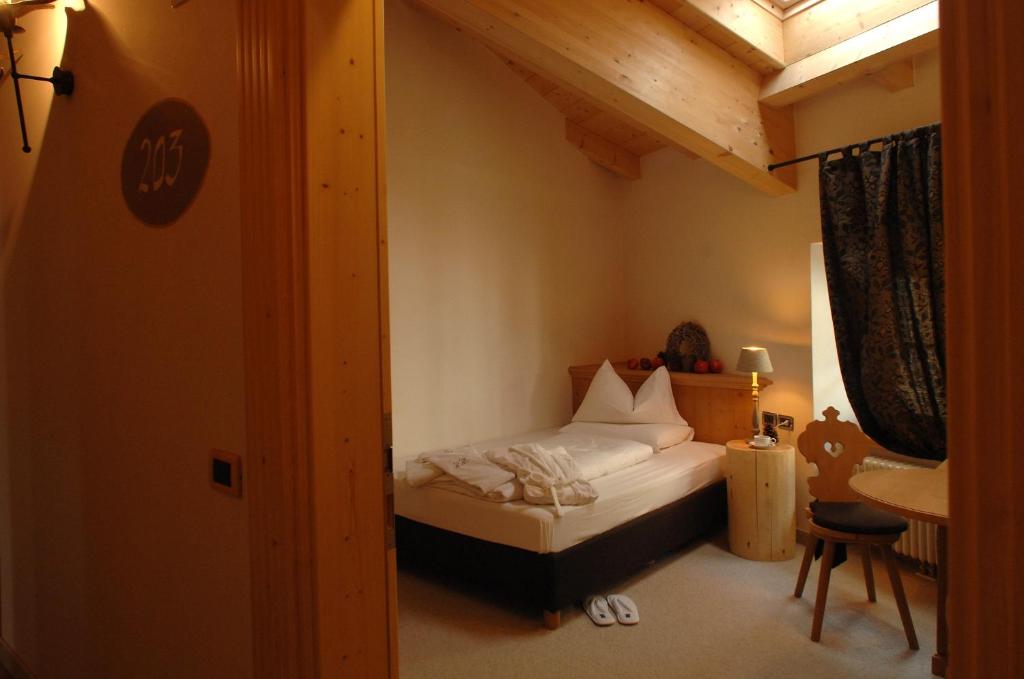 Postel nebo postele na pokoji v ubytování Romantic Hotel Excelsior