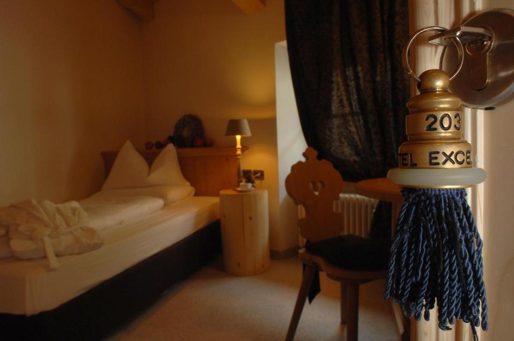 Postel nebo postele na pokoji v ubytování Romantic Hotel Excelsior