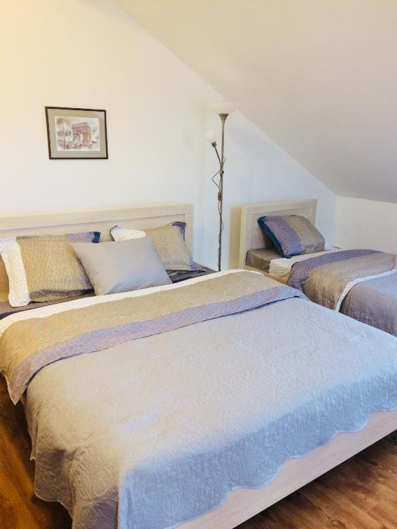 Postel nebo postele na pokoji v ubytování Hotel Cité