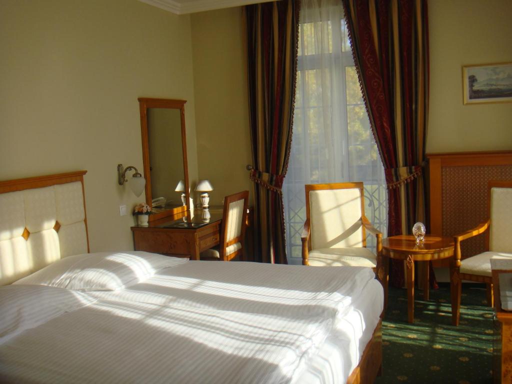 Postel nebo postele na pokoji v ubytování Luxury Garni Hotel Brix