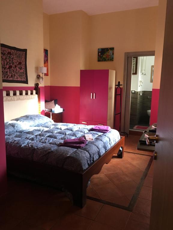 Postel nebo postele na pokoji v ubytování Mondello Room