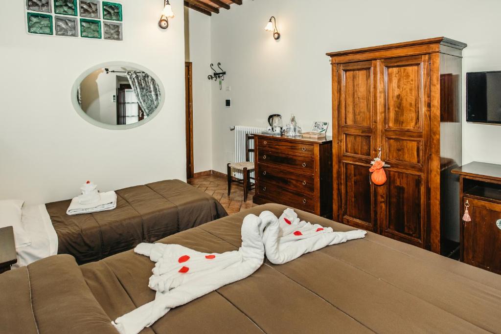Postel nebo postele na pokoji v ubytování Casa Di Campagna In Toscana