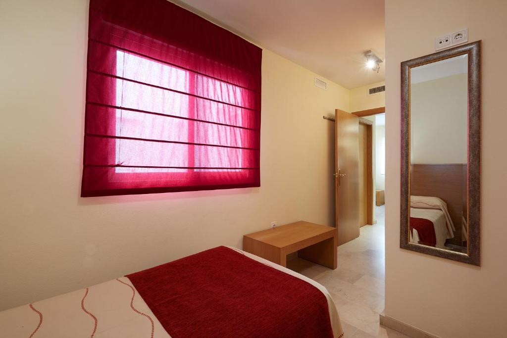 Postel nebo postele na pokoji v ubytování Aparthotel Milord's Suites