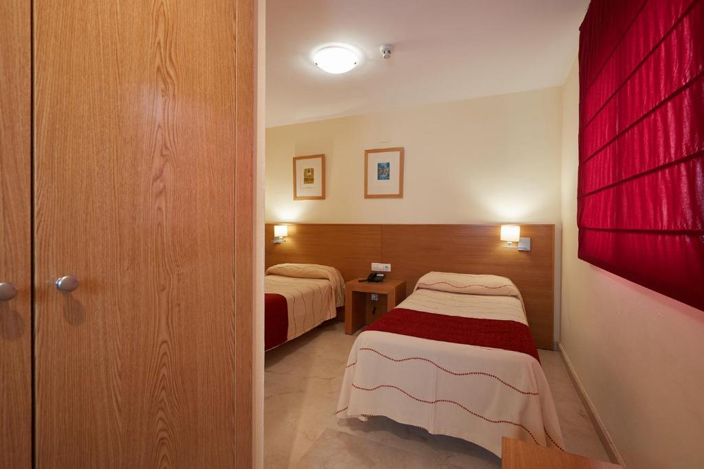 Postel nebo postele na pokoji v ubytování Aparthotel Milord's Suites