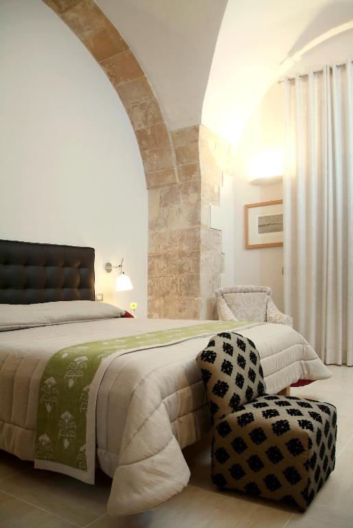 Postel nebo postele na pokoji v ubytování Hotel Novecento