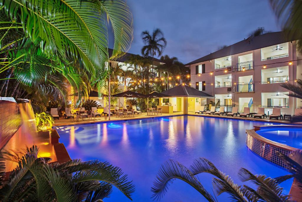 a large swimming pool in front of a building at Central Plaza Port Douglas in Port Douglas